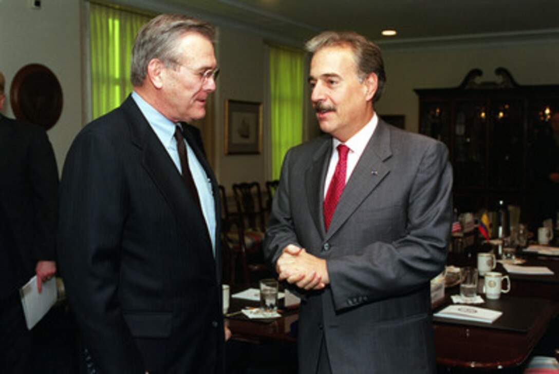 Secretary of Defense Donald H. Rumsfeld (left) talks with Colombian President Andres Pastrana (right) at the conclusion of their Pentagon meeting on Feb. 26, 2001. The two men met to discuss a range of regional issues of interest to both nations. 