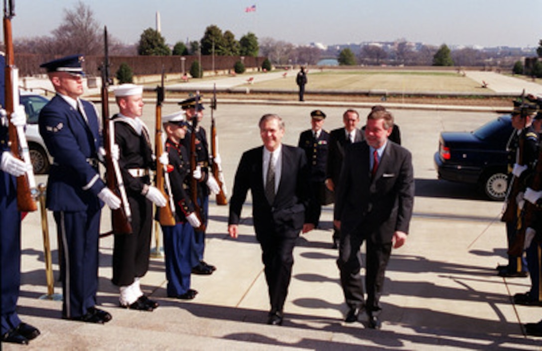 Secretary of Defense Donald H. Rumsfeld (left) escorts Minister of Defense Bjorn Von Sydow, of the Kingdom of Sweden, through an honor cordon and into the Pentagon on Feb. 27, 2001. The two met to discuss a range of regional issues of interest to both nations. 