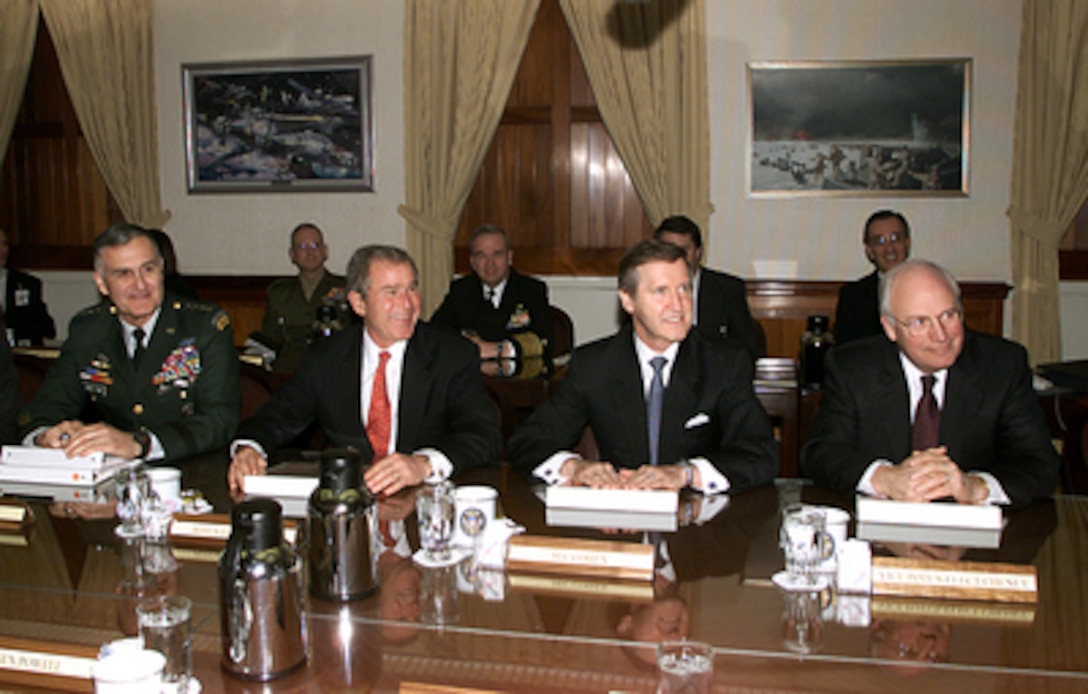 President-elect George W. Bush and Vice President-elect Dick Cheney talk to reporters before their meeting with Chairman of the Joint Chiefs of Staff Gen. Henry H. Shelton, U.S. Army, and Secretary of Defense William S. Cohen in the Tank in the Pentagon on Jan. 10, 2001. Bush, Cheney and members of their National Security team met with Cohen and Shelton and received a briefing from the Joint Chiefs. The Tank is the secure conference room of the Joint Chiefs of Staff. 