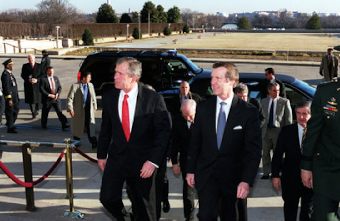 President-elect George W. Bush is escorted into the Pentagon by Secretary of Defense William S. Cohen on Jan. 10, 2001. Bush, Vice President-elect Dick Cheney and members of their National Security team will meet with Cohen and Chairman of the Joint Chiefs of Staff Gen. Henry H. Shelton, U.S. Army, and be briefed by the Joint Chiefs in the Tank. The Tank is the secure conference room of the Joint Chiefs of Staff. 