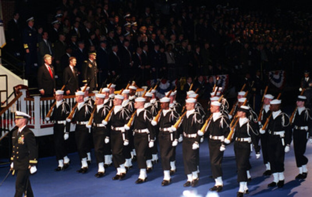 The U.S. Navy Ceremonial Guard passes in review before President Bill Clinton, Secretary of Defense William S. Cohen, and Chairman of the Joint Chiefs of Staff Gen. Henry H. Shelton, U.S. Army, during a ceremonial farewell for Clinton at Fort Myer, Va., on Jan. 5, 2001. Cohen and Shelton are hosting the Armed Forces Review and Awards Ceremony in honor of the president and First Lady Hillary Rodham Clinton. 