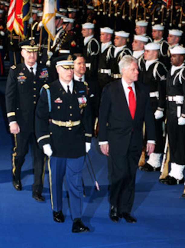 Commander of Troops Col. Thomas M. Jordan, U.S. Army escorts President Bill Clinton as he inspects the ceremonial honor guard during a ceremonial farewell at Fort Myer, Va., on Jan. 5, 2001. Secretary of Defense William S. Cohen, and Chairman of the Joint Chiefs of Staff Gen. Henry H. Shelton, U.S. Army, are hosting the Armed Forces Review and Awards Ceremony in honor of the president and First Lady Hillary Rodham Clinton. 