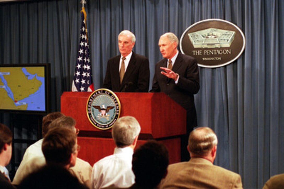 Retired Navy Admiral Harold W. Gehman (left) and retired Army General William W. Crouch brief reporters on the unclassified version of the report of the USS Cole Commission at a Pentagon press conference on Jan. 9, 2001. The USS Cole (DDG 67) was the target of a terrorist attack in the port of Aden, Yemen, on Oct. 12, 2000, during a scheduled refueling. The attack killed 17 crew members and injured 39 others. The report looks into the terrorist incident to find ways of reducing our vulnerability to similar tactics in the future. Gehman and Crouch were appointed as co-commissioners by Secretary of Defense William S. Cohen. 