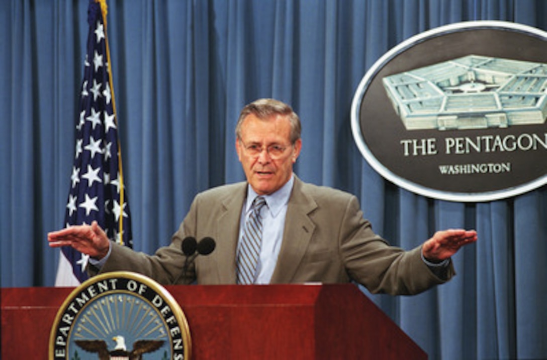 Secretary of Defense Donald H. Rumsfeld gestures to make his point as he answers a question during a briefing by Under Secretary of Defense (Comptroller) Dov Zakheim on the Bush Administration's amended fiscal 2002 budget request for the Department of Defense June 27, 2001. 