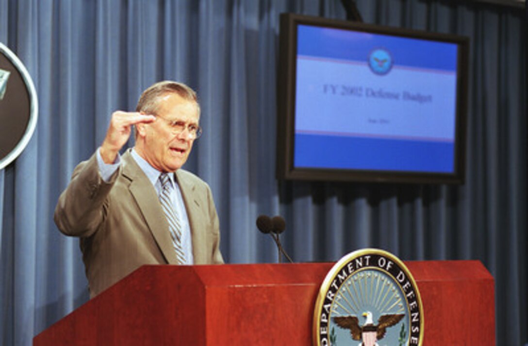 Secretary of Defense Donald H. Rumsfeld responds to a question during a briefing by Under Secretary of Defense (Comptroller) Dov Zakheim on the Bush Administration's amended fiscal 2002 budget request for the Department of Defense June 27, 2001. 