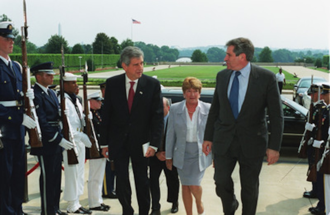 Vice Minister of Defense Angel Tello (left), of the Argentine Republic, is escorted into the Pentagon by Deputy Secretary of Defense Paul Wolfowitz (right) June 28, 2001. The two leaders are meeting to discuss issues of interest to both countries. 