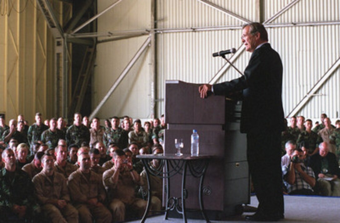 Secretary of Defense Donald H. Rumsfeld addresses a large audience of U.S., Turkish, and British military personnel at Incirlik Air Base, Turkey, on June 4, 2001. Rumsfeld stopped at Incirlik after a morning of meeting with high-level officials of the Turkish Government in Ankara, the nation's capitol. Rumsfeld commented that he follows reports coming out of Operation Northern Watch, which is headquartered at Incirlik, very closely and was looking forward to meeting and talking with the personnel who make the operation work so successfully. After concluding his formal remarks, Rumsfeld stepped off the stage and walked into the audience to do just that. 
