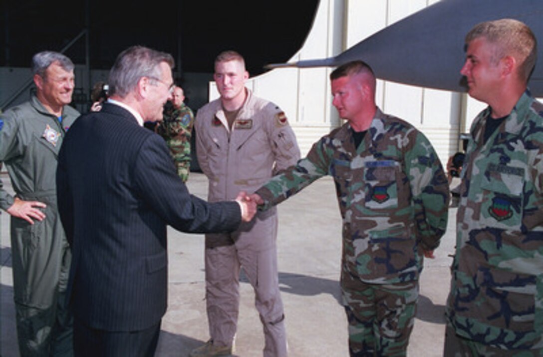 Brig. Gen. Edward ("Buster") R. Ellis (left), USAF, the U.S. co-commander of Combined Task Force Operation Northern Watch headquartered at Incirlik Air Base, Turkey, introduces one of his F-16 pilots, 1Lt. Quenten Esser (3rd from left) and two ground crew personnel to visiting Secretary of Defense Donald H. Rumsfeld. Rumsfeld stopped at Incirlik on June 4, 2001, to receive detailed briefings from Brig. Gen. Ellis and his staff and to visit with the service personnel of the U.S., Turkey, and the United Kingdom who are working to fulfill the mission of the combined task force. Turkey was Rumsfeld's first stop in a planned seven-day, seven-nation European tour. 