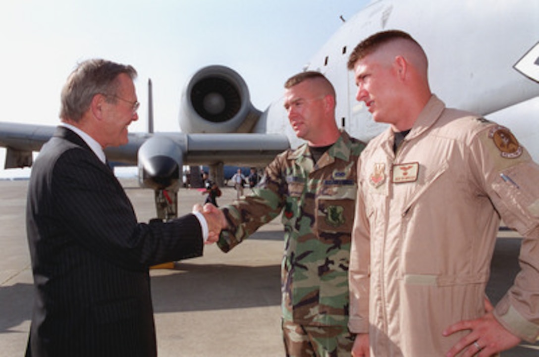 Secretary of Defense Donald H. Rumsfeld greets Air Force Staff Sergeant Ward and Capt. Rasmussen (right) during his visit to Incirlik Air Base, Turkey, June 4, 2001. Incirlik Air Base, the headquarters of Combined Task Force Operation Northern Watch, is home to a number of aviation units from the U.S., Turkey, and Great Britain that regularly patrol the skies over northern Iraq to enforce the no-fly zone. If one of those aircraft were to crash, either as a result of hostile action or due to a system failure, Capt. Rasmussen, or one of his fellow A-10 Thunderbolt II pilots, would be called on to search for the downed pilot or aircrew. Once the downed airman was located, the A-10s would also provide armed escort for the rescue helicopters. As a reflection of their mission of combat search and rescue, the pilots of the 23rd Fighter Group wear a patch on their left shoulder featuring an image of Elvis Presley with the slogan: "If He's Out There ... We'll Find Him." Turkey was the first stop on a seven-day, seven-country, European tour by Secretary of Defense Rumsfeld. 