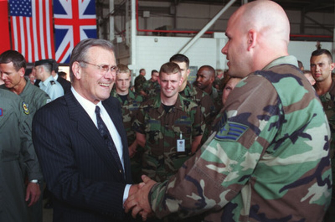 Secretary of Defense Donald H. Rumsfeld greets a U.S. Air Force staff sergeant serving with Combined Task Force Northern Watch at Incirlik Air Base, Turkey. Rumsfeld stopped at Incirlik on June 4, 2001, to receive detailed briefings from the Task Force Co-commander Brig. Gen. Edward "Buster" Ellis and his staff and to visit with service personnel of the U.S., Turkey, and the United Kingdom who make possible the patrols of the no-fly zone in northern Iraq. 