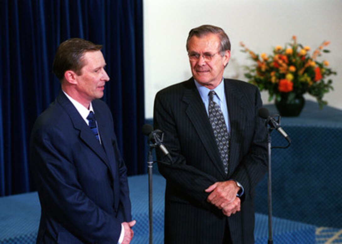 Secretary of Defense Donald H. Rumsfeld (right) and Russian Defense Minister Sergey Borisovich Ivanov (left) participate in a press conference at NATO Headquarters in Brussels, Belgium, on June 8, 2001. The two defense leaders had earlier taken part in the NATO Permanent Joint Council (Defense) and the Euro-Atlantic Partnership Council meetings and conducted bilateral discussions. 