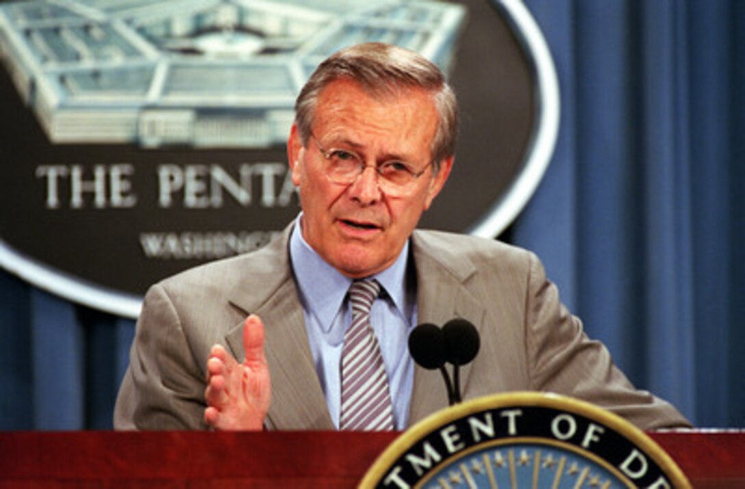 Secretary of Defense Donald H. Rumsfeld gestures to emphasize a point as he responds to a reporter's question regarding the Quadrennial Defense Review during a media availability at the Pentagon on July 18, 2001. 