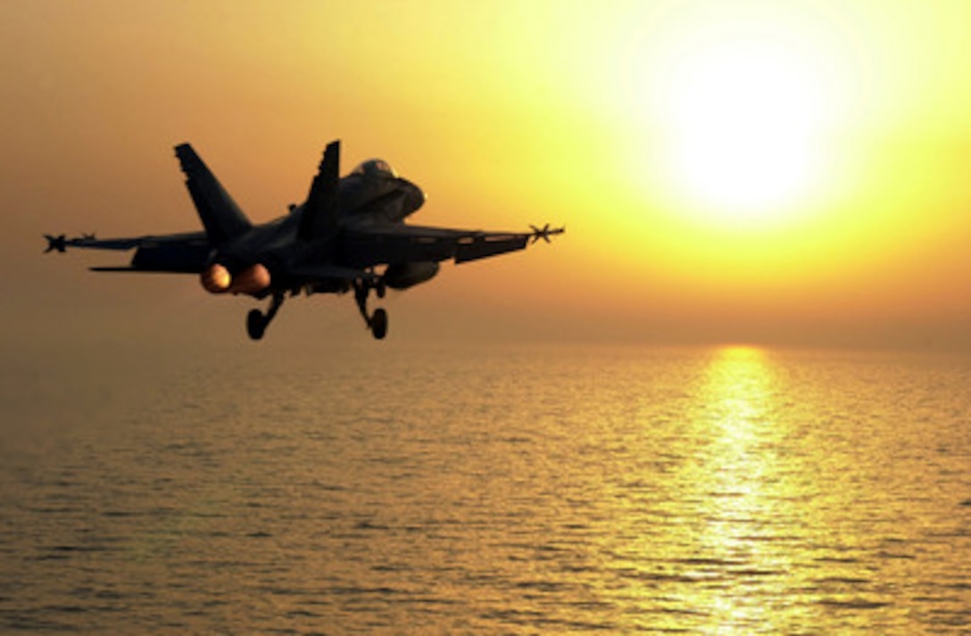 An F/A-18 Hornet launches towards the sun from the flight deck of the aircraft carrier USS Constellation (CV 64) as the ship steams in the Persian Gulf on July 29, 2001. Constellation and its embarked Carrier Air Wing 2 are operating in the Persian Gulf in support of Operation Southern Watch which is the U.S. and coalition enforcement of the no-fly-zone over Southern Iraq. The Hornet is from Strike Fighter Squadron 137, Naval Air Station Lemoore, Calif. 