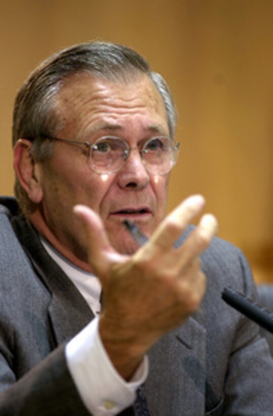 Secretary of Defense Donald H. Rumsfeld answers a question during a press conference at the conclusion of the Australia-U.S. Ministerial talks at Parliament House, Canberra, Australia, on July 30, 2001. Rumsfeld, Secretary of State Colin Powell and U.S. Pacific Command Commander in Chief Adm. Dennis Blair, U.S. Navy, met with Australian Minister for Foreign Affairs Alexander Downer and Minister of Defence Peter Reith for talks to further advance the Australia-United States alliance relationship. 