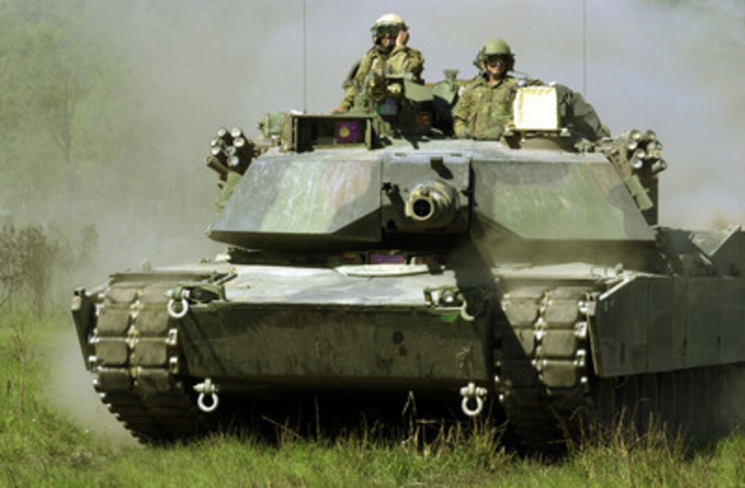 An M-1A1 Abrams tank from 1st Tank Battalion, 3rd Marines, maneuvers before a live fire assault at Shoalwater Bay Training Area, Queensland, Australia, on May 25, 2001 for Exercise Tandem Thrust 2001. Tandem Thrust is a combined military training exercise involving more than 18,000 U.S., Australian, and Canadian personnel who are training in crisis action planning and execution of contingency response operations. 