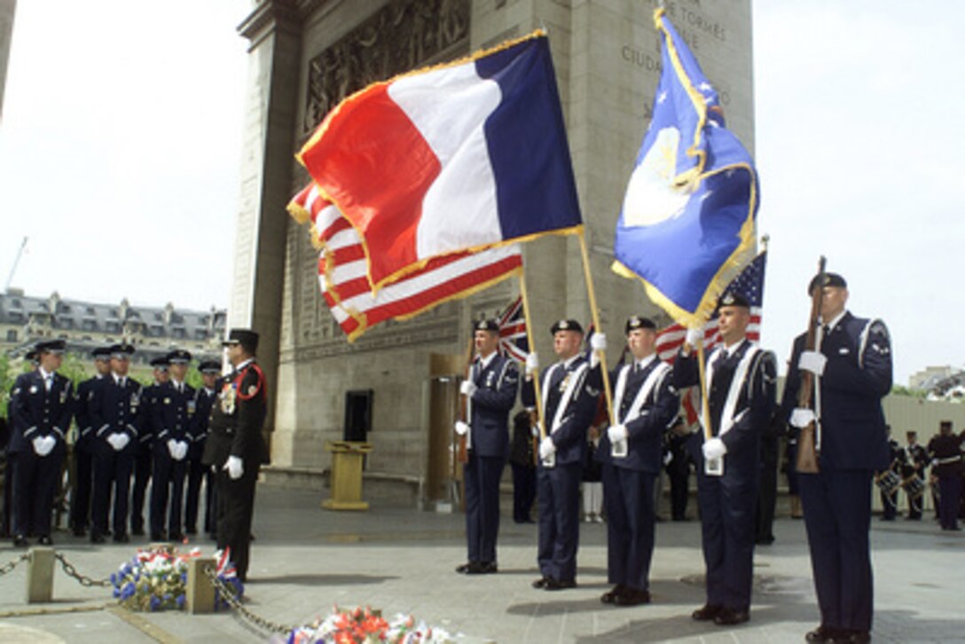 Members of the U.S. Air Forces in Europe, Special Security Squadron, of Ramstein, Germany, present the colors during a Memorial Day ceremony at the tomb of France's unknown soldier in the Arc de Triomphe in Paris, France, on May 27, 2001. 
