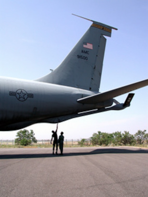 Air Force Airman 1st Class Fausto Olivo (left) and Capt. Sushil Ramrakha perform pre-flight aircraft checks on their KC-135 Stratotanker at Istres, France, on May 28, 2001. The Stratotanker will fly an aerial refueling mission over the Adriatic Sea, refueling U.S. and NATO aircraft patrolling the Balkan region in support of NATO Operation Joint Forge. Ramrakha, a Stratotanker pilot, and Olivo, a Stratotanker crew chief, are deployed with about 20 other aircrew members and maintenance personnel from McConnell Air Force Base, Kan., to the 16th Expeditionary Operations Group. 