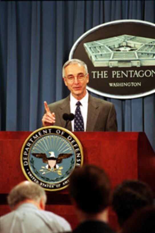 Secretary of the Navy Gordon England responds to a reporter's question concerning his role in the management of the Department of Defense during a Pentagon press briefing on June 18, 2001. 