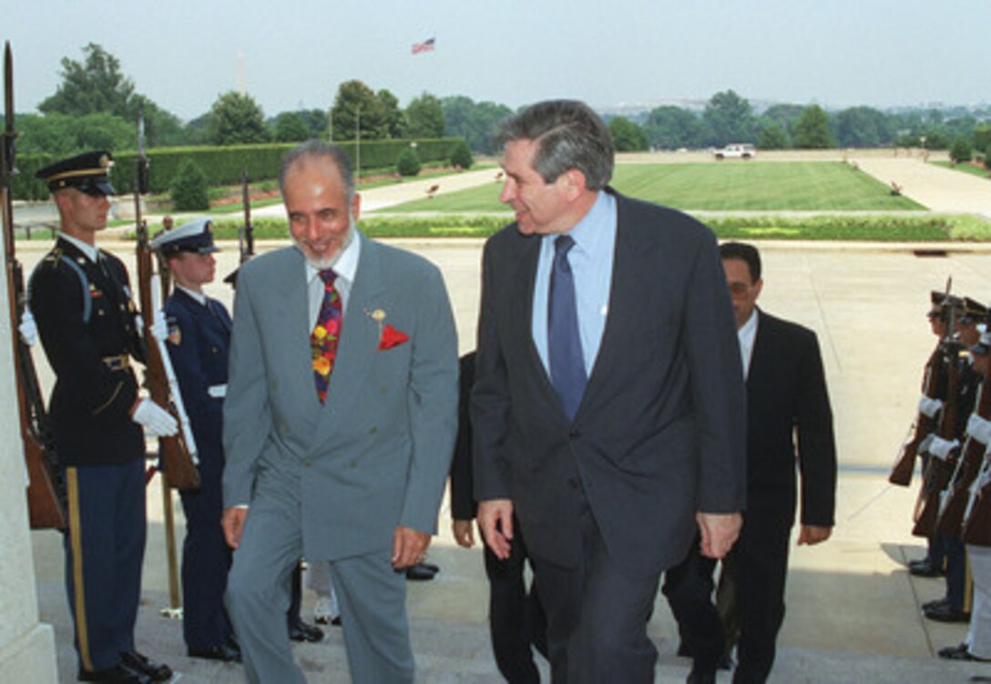 Deputy Secretary of Defense Paul Wolfowitz (right) escorts His Excellency Ysuf bin Alawi (left), minister responsible for foreign affairs of Oman, into the Pentagon on June 20, 2001. Wolfowitz and Minister Ysuf met to discuss a range of regional security issues of interest to both nations. 