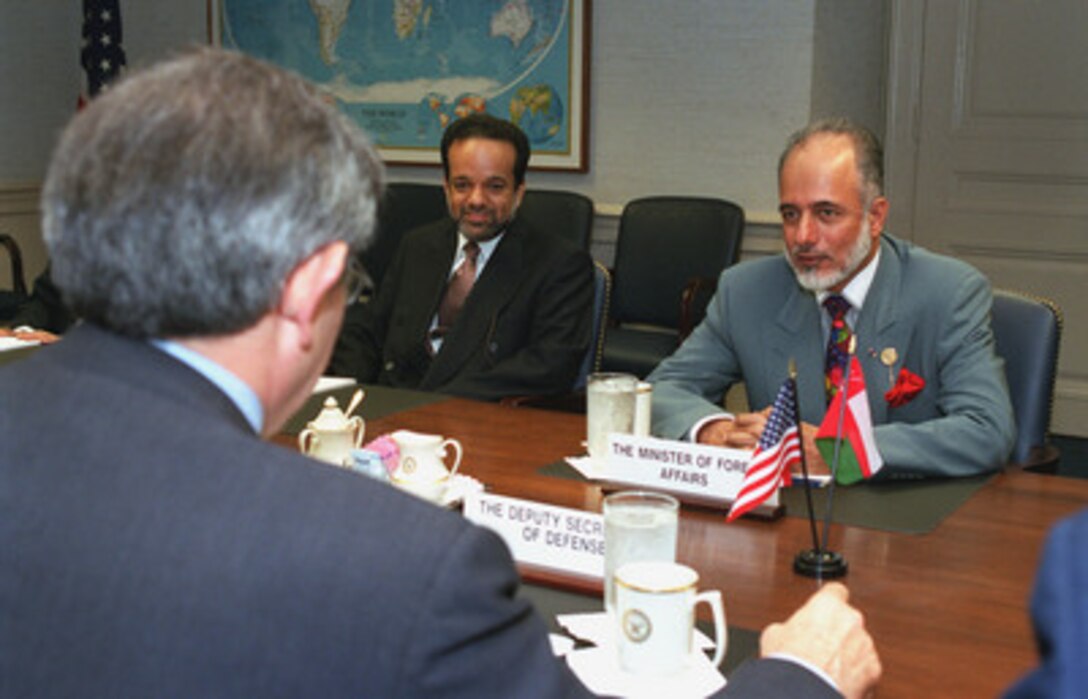 His Excellency Ysuf bin Alawi (right), minister responsible for foreign affairs of Sultanate of Oman, meets with Deputy Secretary of Defense Paul Wolfowitz (left) at the Pentagon, June 20, 2001. A broad range of regional security issues of interest to both nations were discussed. Also participating in the talks was Oman's Ambassador to the United States Mohammed Al-Khosaibi (center). 