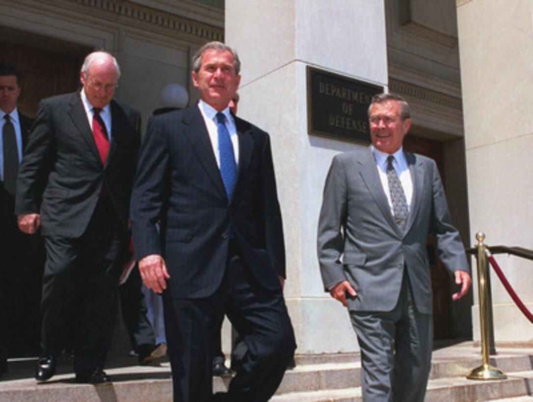 Secretary of Defense Donald H. Rumsfeld (right) escorts President George W. Bush (center) and Vice President Dick Cheney (left) as they depart the Pentagon June 19, 2001. Bush was in the Pentagon to visit the Computer/Electronic Accommodations Program Technology Evaluation Center (CAPTEC), and address Department of Defense personnel. CAPTEC provides assistive technology, such as adaptive computers, electronic equipment and devices specially designed to meet the needs of employees with disabilities. 