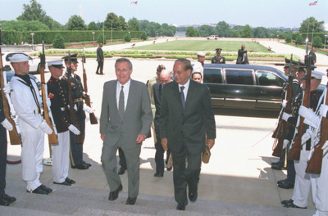 Abdul Sattar (right), Pakistan's minister of foreign affairs, arrives at the Pentagon, June 19, 2001, where he is escorted to the meeting room by his host, Secretary of Defense Donald H. Rumsfeld (left). Minister Sattar met with both Rumsfeld and Deputy Secretary of Defense Paul Wolfowitz to discuss a range of regional issues of interest to both nations. 