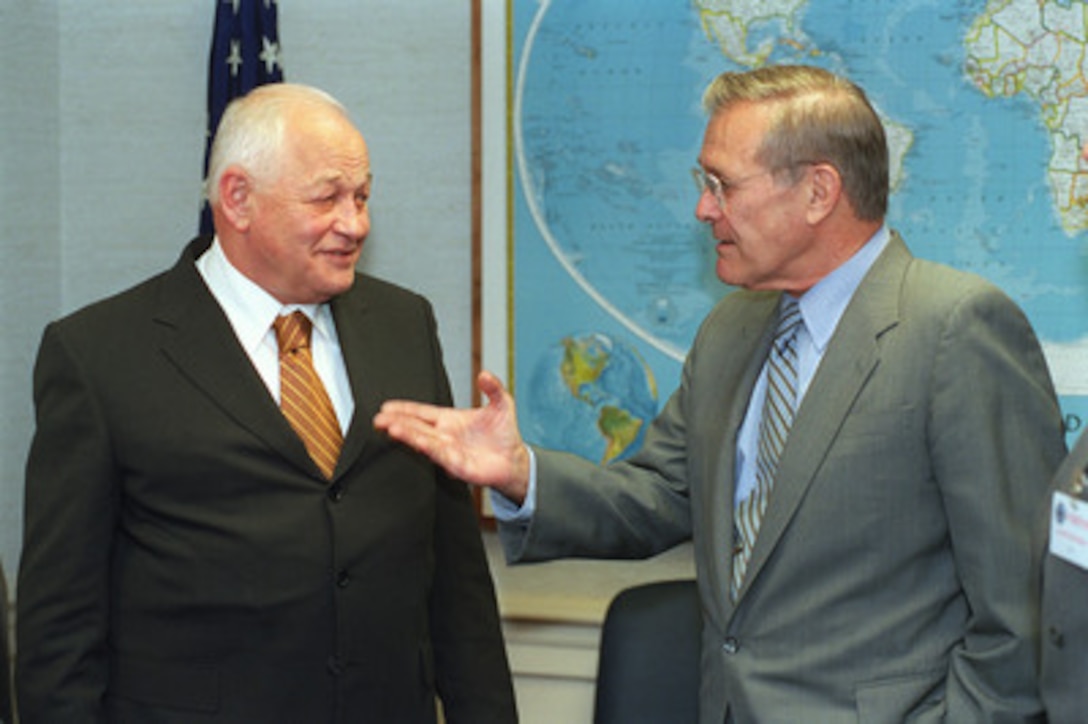 Secretary of Defense Donald H. Rumsfeld (right) discusses ballistic missile defense with Marshal Igor Sergeyev (left), special advisor on strategic stability to Russian President Vladimir Putin, at the Pentagon, June 20, 2001. 