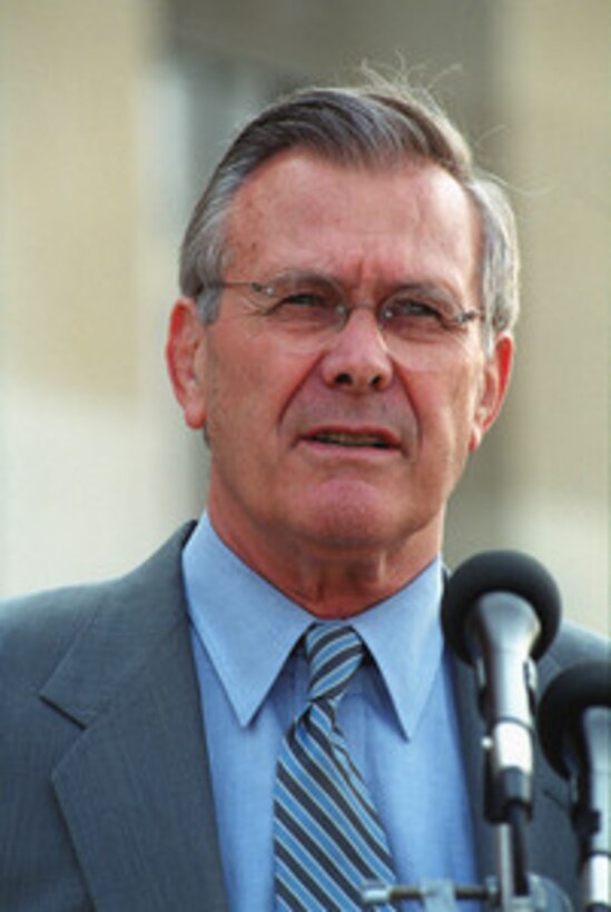 Secretary of Defense Donald H. Rumsfeld listens to a reporter's question during a joint media availability following his Pentagon meeting with NATO Secretary General Lord George Robertson on June 20, 2001. 