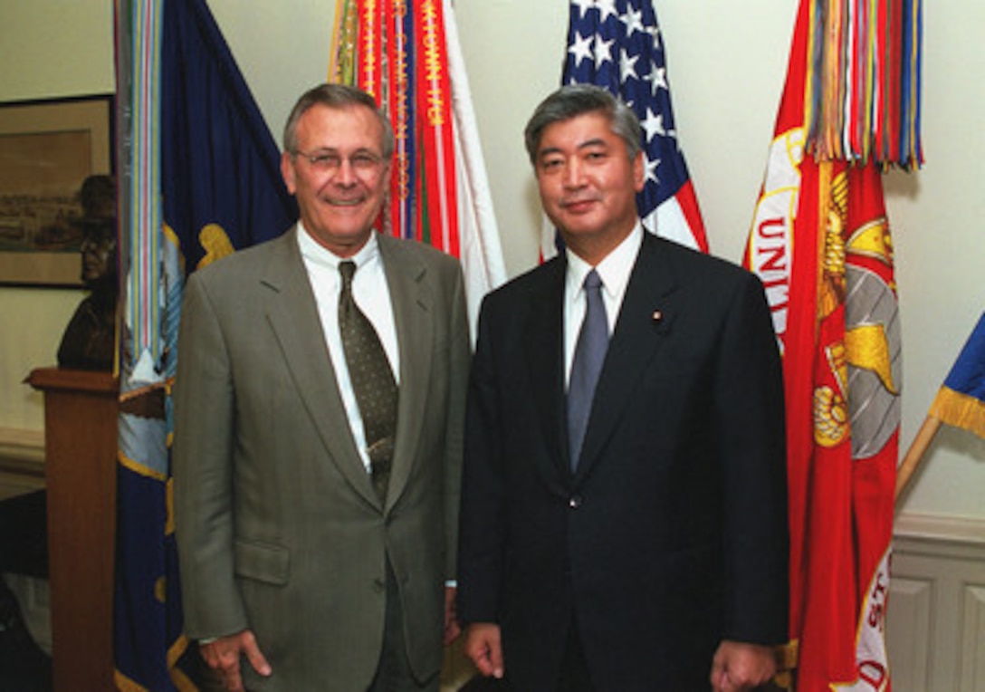 Before beginning substantive talks on a variety of security issues, Secretary of Defense Donald H. Rumsfeld (left) and Director General of the Japan Defense Agency Gen Nakatani (right), pose for a photo at the Pentagon, June 22, 2001. 