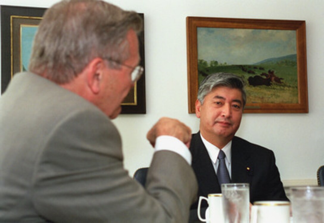 Secretary of Defense Donald H. Rumsfeld (left) meets in his Pentagon office, June 22, 2001, with visiting Director General of the Japan Defense Agency Gen Nakatani (right). A variety of regional and global security issues were discussed. Nakatani's visit, which began with a full honor arrival ceremony held on the Pentagon parade field, featured a working luncheon attended by many senior Department of Defense officials and concluded with a press conference. 