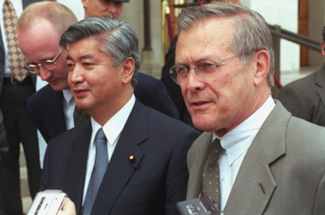 Secretary of Defense Donald H. Rumsfeld (right) joined by the director general of the Japan Defense Agency Gen Nakatani (left), hold a media availability on the Pentagon steps, June 22, 2001, at the conclusion of their meetings. 