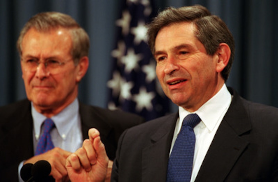 The newly confirmed Deputy Secretary of Defense Paul Wolfowitz (right) emphasizes a point as he talks to reporters in the Pentagon on March 1, 2001. Secretary of Defense Donald Rumsfeld (left) introduced Wolfowitz to reporters during a Pentagon news briefing. 