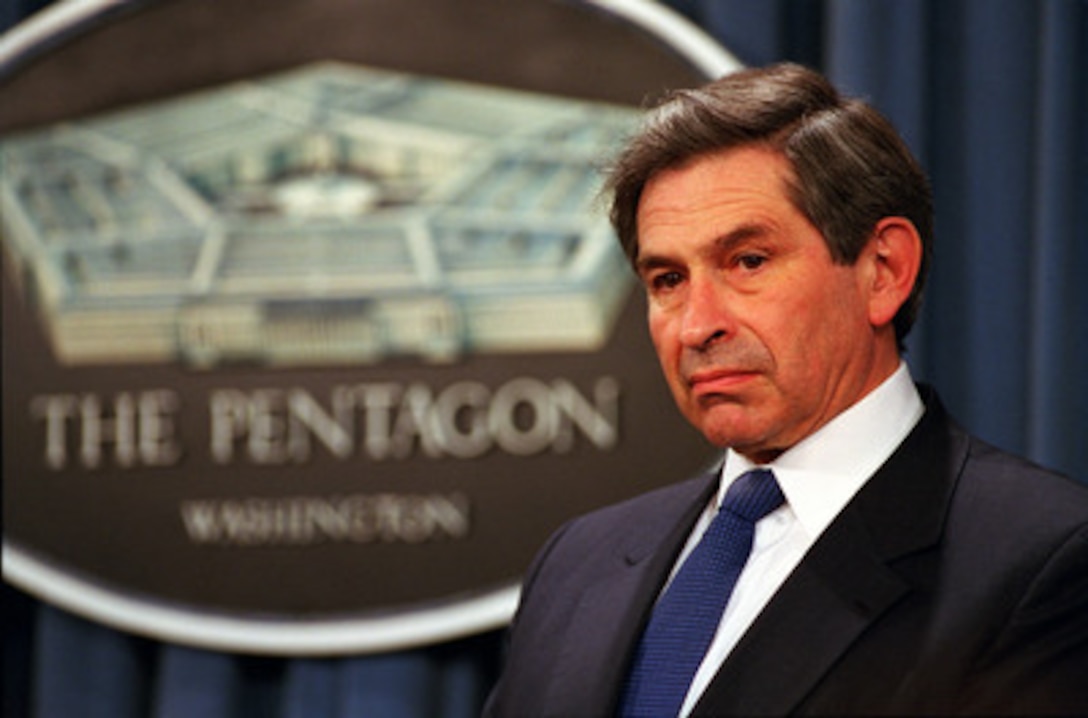Newly confirmed Deputy Secretary of Defense Paul Wolfowitz listens to a reporter's question during the March 1, 2001, Pentagon news briefing. Secretary of Defense Donald Rumsfeld used the occasion to introduce Wolfowitz, a renowned defense policy analyst, to the press corps. 