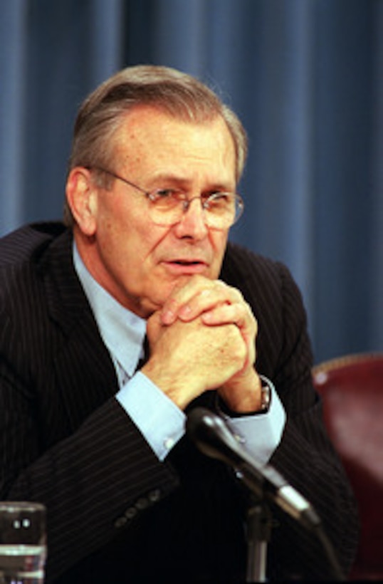 Secretary of Defense Donald H. Rumsfeld listens to a reporter's question during a joint press conference with NATO Secretary General Lord George Robertson at the Pentagon on March 8, 2001. 