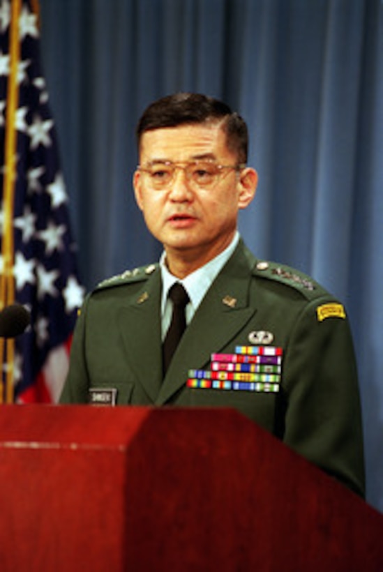 Army Chief of Staff Gen. Eric Shinseki responds to a reporter's question during a Pentagon press briefing on the Army beret with Deputy Secretary of Defense Paul Wolfowitz on March 16, 2001. Wolfowitz and Shinseki announced the Army's decision to adopt the black beret as its standard garrison hat and to allow the Rangers to change the color of their beret to tan. 