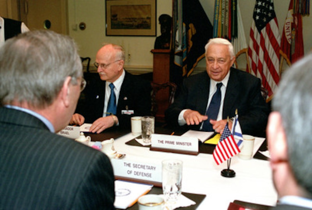 Israeli Prime Minister Ariel Sharon (right) meets in the Pentagon with Secretary of Defense Donald H. Rumsfeld (near left) on March 19, 2001. Sharon and Rumsfeld are meeting to discuss regional and international security issues of interest to both nations. Israeli Ambassador to the U.S. David Ivry joined Sharon in the talks. 