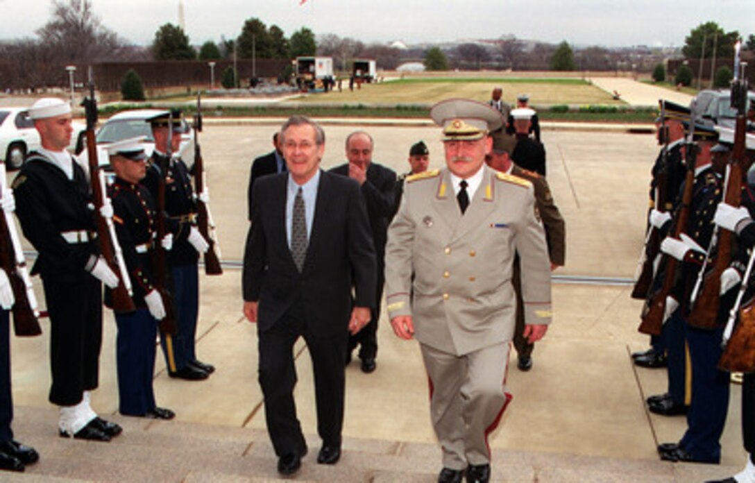Secretary of Defense Donald H. Rumsfeld (left) escorts Minister of Defense David Tevzadze, of the Republic of Georgia, through an honor cordon and into the Pentagon on March 16, 2001. The two defense leaders will hold discussions on a range of regional security issues of interest to both nations. 