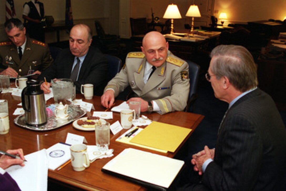 Secretary of Defense Donald H. Rumsfeld (right) meets in his Pentagon office with Minister of Defense David Tevzadze (second from right), of the Republic of Georgia, on March 16, 2001. Georgian Ambassador Tedo Japaridze (second from left) and Lt. Col. Archil Tsintsadze, the Georgian defense attaché, joined Rumsfeld and Tevzadze as they discussed a range of regional security issues of interest to both nations. 
