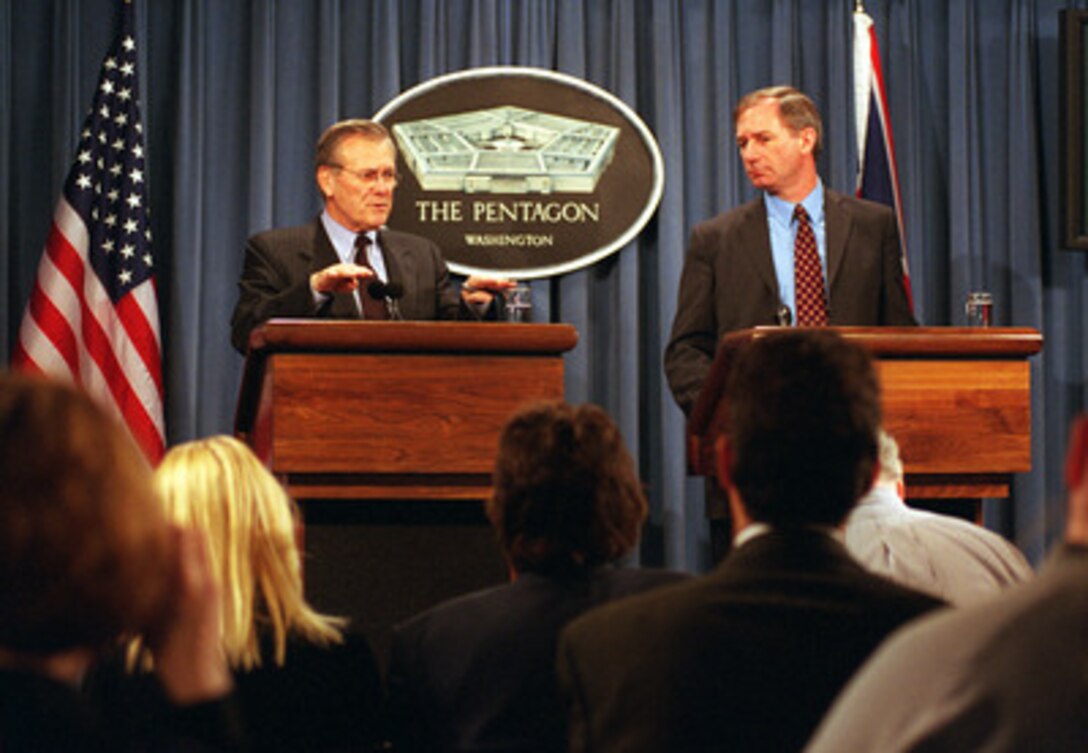 Secretary of Defense Donald H. Rumsfeld (left) responds to a reporter's question about the Joint Strike Fighter program during a joint news conference with the United Kingdom's Secretary of State for Defence Geoffrey Hoon, at the Pentagon on March 21, 2001. Rumsfeld and Hoon held bilateral talks earlier to discuss security issues of interest to both nations. The Joint Strike Fighter is being funded jointly by the United States and United Kingdom. 