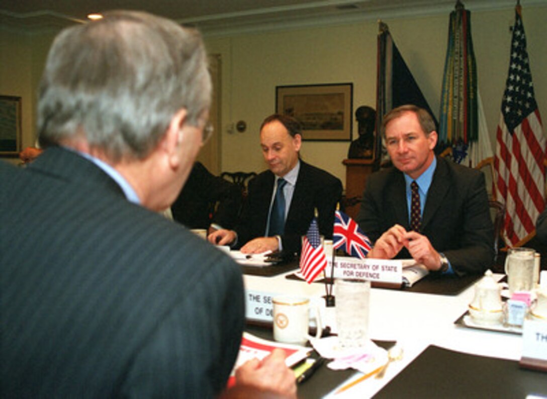 Secretary of Defense Donald H. Rumsfeld (left) meets in the Pentagon with the United Kingdom's Secretary of State for Defence Geoffrey Hoon, on March 21, 2001. Rumsfeld and Hoon are conducting bilateral talks to discuss a range of regional security issues of interest to both nations. 