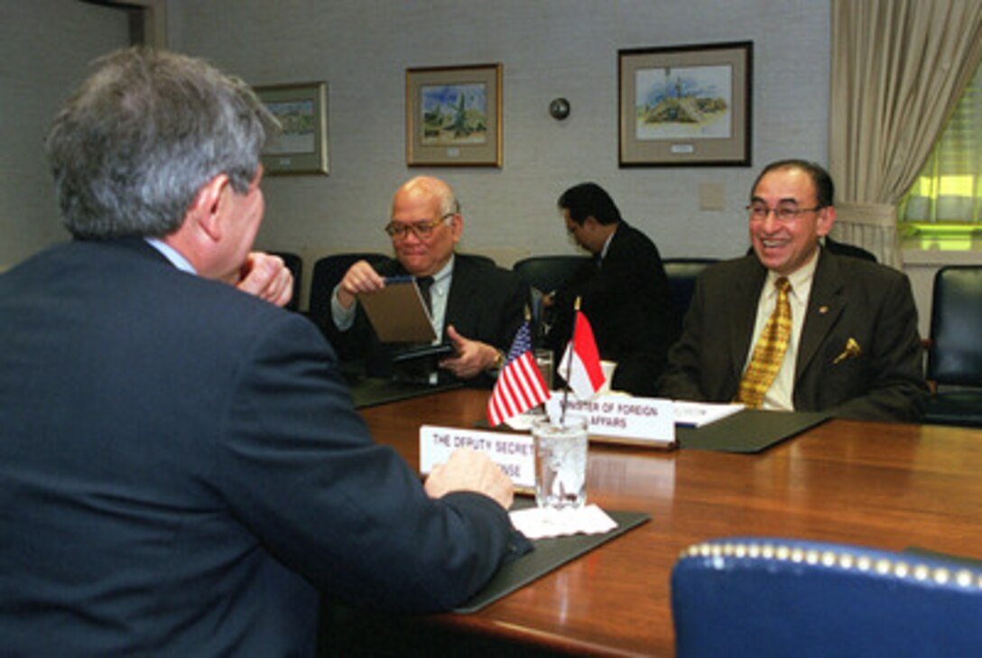Indonesian Minister of Foreign Affairs Alwi Abdurrahman Shihab (right) meets with Deputy Secretary of Defense Paul Wolfowitz (foreground) in the Pentagon on March 12, 2001. Shihab and Wolfowitz are meeting to discuss regional security issues of interest to both nations. 