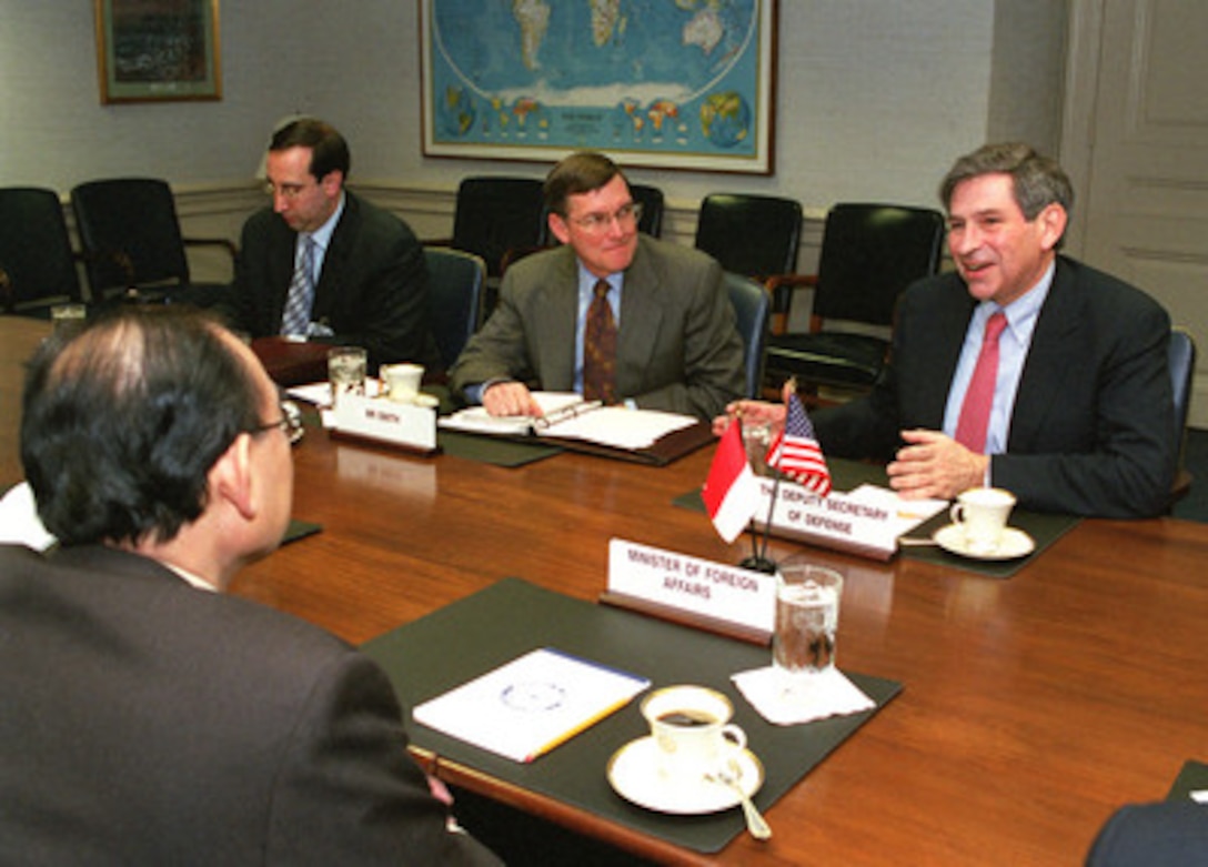 Deputy Secretary of Defense Paul Wolfowitz (right) meets with Indonesian Minister of Foreign Affairs Alwi Abdurrahman Shihab (foreground) in the Pentagon on March 12, 2001. Wolfowitz and Shihab are meeting to discuss regional security issues of interest to both nations. 