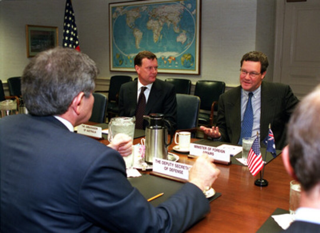 Australian Minister of Foreign Affairs Alexander Downer (right) meets with Deputy Secretary of Defense Paul Wolfowitz (foreground) in the Pentagon on March 21, 2001. Downer was accompanied by Australian Ambassador to the United States Michael Thawley (center). 