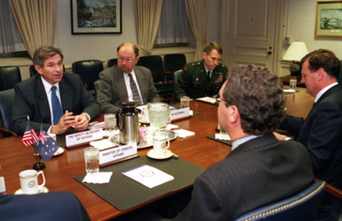 Deputy Secretary of Defense Paul Wolfowitz (left) meets with Australian Minister of Foreign Affairs Alexander Downer (foreground) in the Pentagon on March 21, 2001. Principal Deputy Assistant Secretary of Defense for International Security Affairs Bernd McConnell (center), and Brig. Gen. John Batiste, U.S. Army, joined Wolfowitz in the meeting with Downer and Australian Ambassador to the U.S. Michael Thawley (right). 