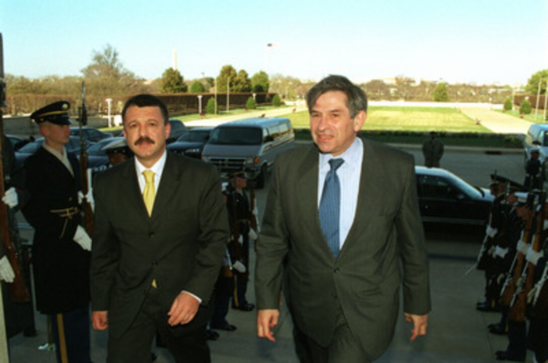 Deputy Secretary of Defense Paul Wolfowitz (right) escorts Bulgarian Minister of Defense Boyko Noev (left) into the Pentagon on March 26, 2001. The two men will meet to discuss a range of regional security issues of interest to both nations. 