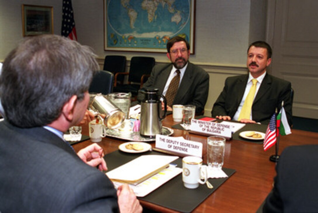 Minister of Defense Boyko Noev (right), of the Republic of Bulgaria, meets with Deputy Secretary of Defense Paul Wolfowitz (left) at the Pentagon on March 26, 2001. Bulgarian Ambassador to the United States Phillip Dimitrov (center) joined Noev and Wolfowitz to discuss a range of regional security issues of interest to both nations. 
