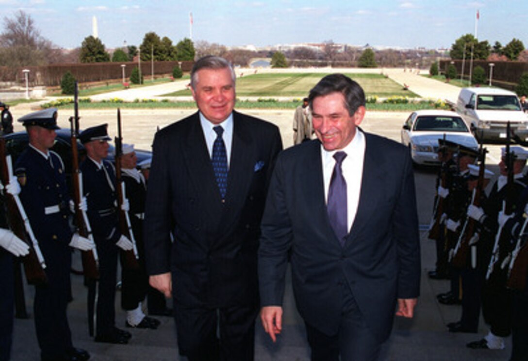 Deputy Secretary of Defense Paul Wolfowitz (right) escorts Minister of Foreign Affairs Anatoliy Zlenko, of Ukraine, into the Pentagon on March 27, 2001. The two men will meet to discuss a range of regional security issues of interest to both nations. 