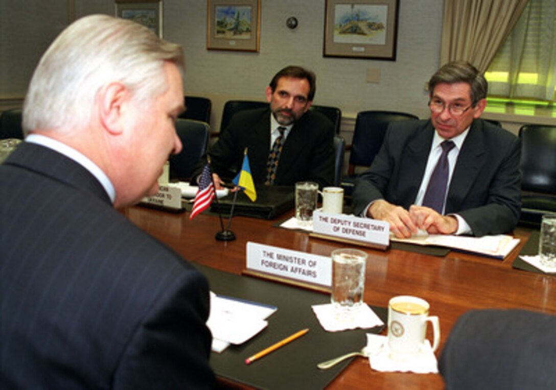 Deputy Secretary of Defense Paul Wolfowitz (right) meets at the Pentagon with Minister of Foreign Affairs Anatoliy Zlenko (left), of Ukraine, on March 27, 2001. United States Ambassador to Ukraine Carlos Pascual (center) joined Wolfowitz and Zlenko to discuss a range of regional security issues of interest to both nations. 