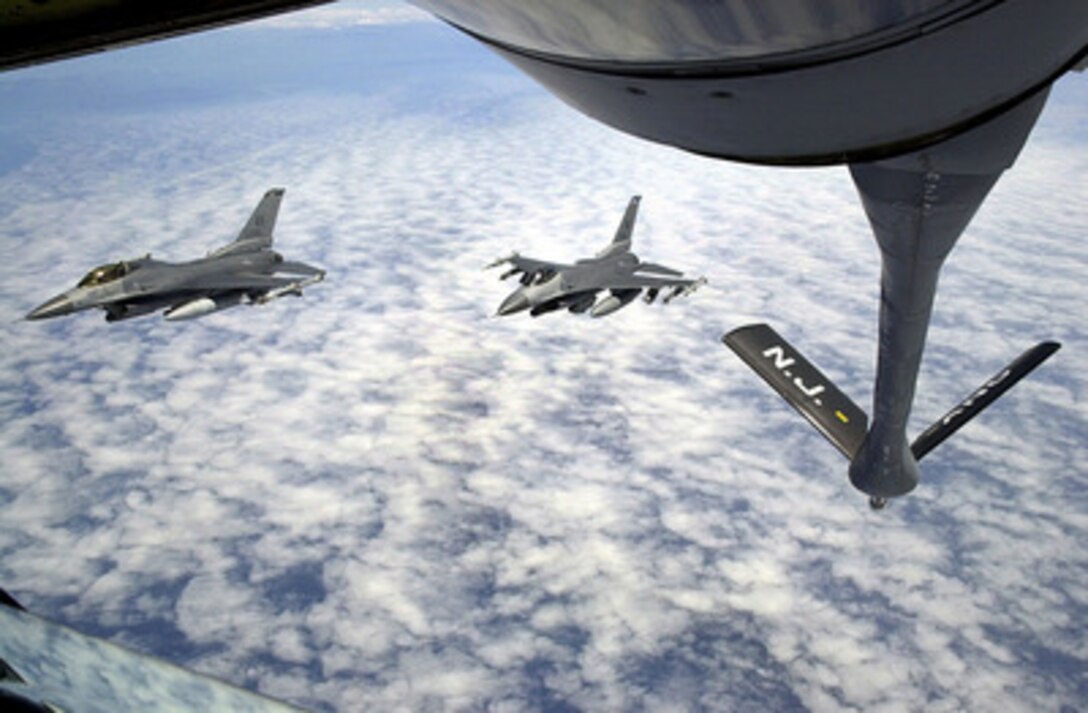 U.S. Air Force F-16 Fighting Falcons drop away from the refueling boom of a KC-135 Stratotanker after an in-flight refueling over the Adriatic Sea on April 27, 2001. The high performance fighters are operating out of Aviano Air Base, Italy, in support of ongoing NATO operations in the Balkans. The Stratotanker is deployed from the New Jersey Air National Guard's 108th Air Refueling Wing of McGuire Air Force Base. 