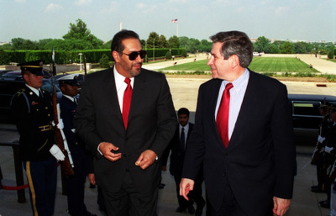 Minister of Foreign Affairs Sheikh Hamad bin Jasim bin Jabir Al-Thani (left), of the State of Qatar, arrives at the Pentagon on May 3, 2001, for a meeting with Deputy Secretary of Defense Paul Wolfowitz (right). The two diplomats will hold talks on a range of security issues of interest to both nations. 